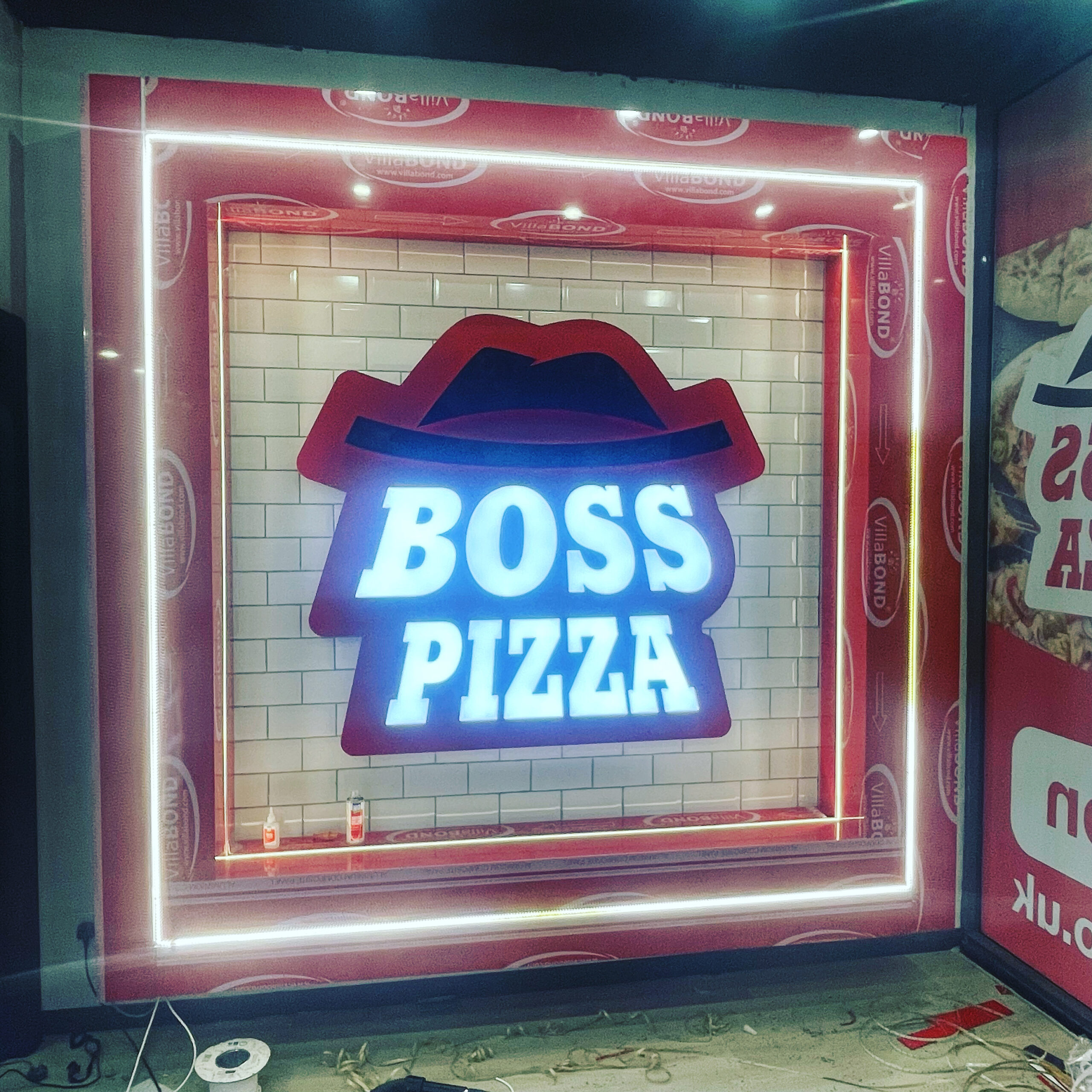 badr signs slide boss pizza